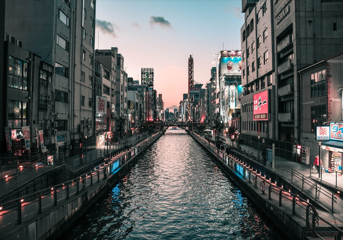 dotonbori street view with neon lights and pedestrians