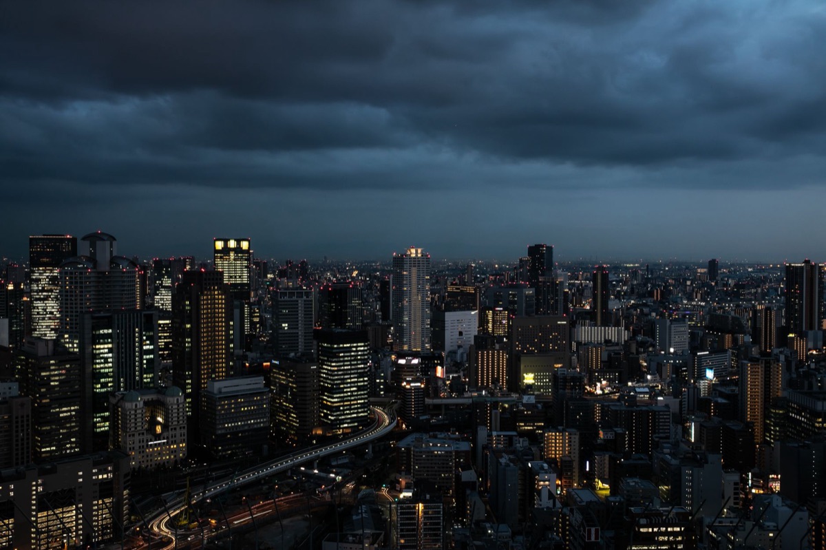osaka cityscape at night with glowing lights and neon signs