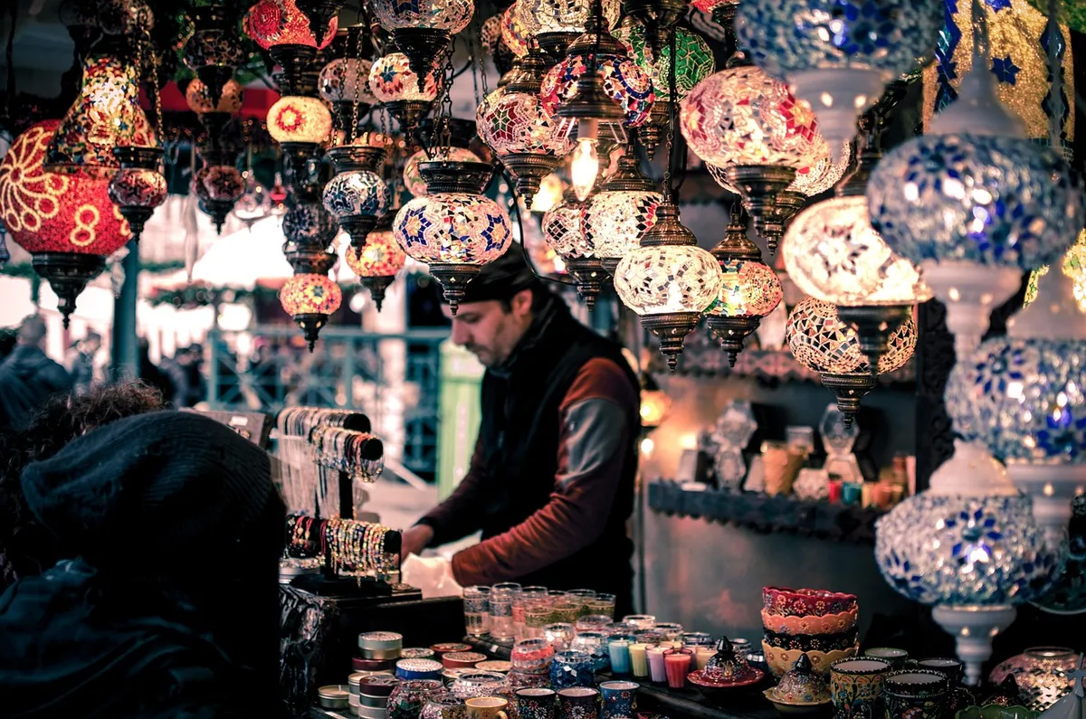 bazaar, booth, bracelets, candles, commerce, group, lamps, man, market, merchant, people, person, sale, sell, shop, shopping, souvenir, stock, arabic, lanterns,